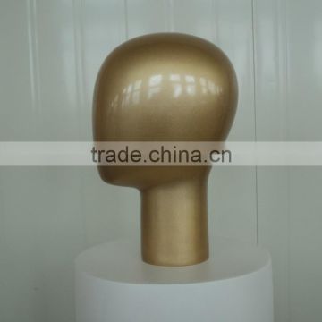 Golden Female Mannequin Head Displaying Hats, wigs, scarves, and necklaces