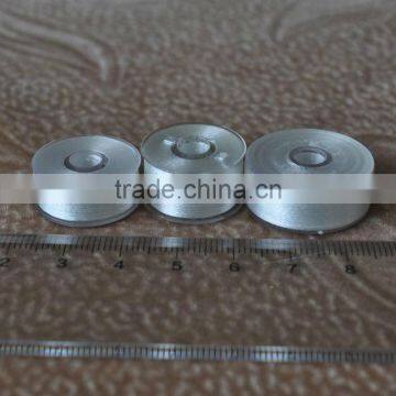 White plastic thread bobbins