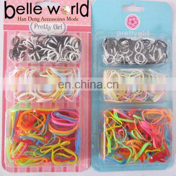 Girl's colorful rubber hairbands in plastic box