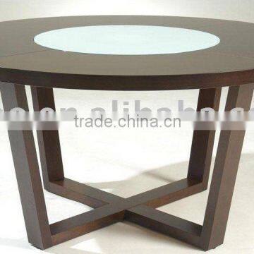 Modern table with rotating glass in middle