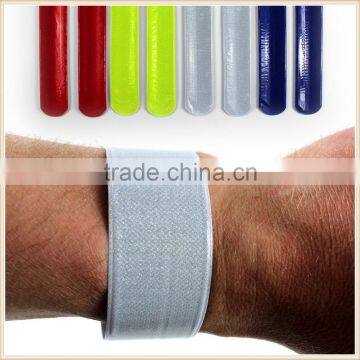 A PAIR OF HIGH-VIZ KIDS REFLECTIVE SLAP SNAP BANDS FLUORESCENT SAFETY STRAPS