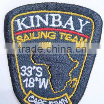 Wholesale cheap custom fashion decorative machine woven / embroidery badge shield or other