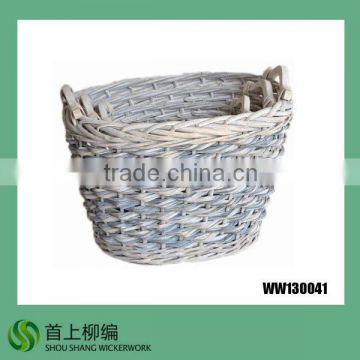 white oval wicker laundry basket