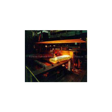 Steel slab induction heat treatment machine