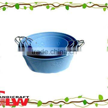 set of 4 handmade and durable circular shaped metal buckets for home cleaning with handle and flower patterns