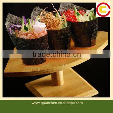 Bamboo sushi stand with various holes