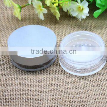 Loose powder jar with silver lid for cosmetic use