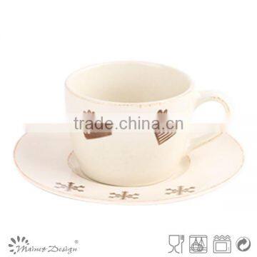 high-volume Christmas coffee cup and saucer