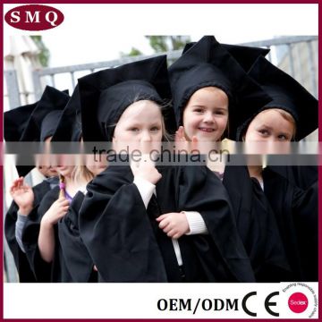 Academic primary school students graduation caps and gowns