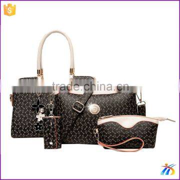 Alibaba new style black 4pcs set handbags fashion flower pendant handbag key set