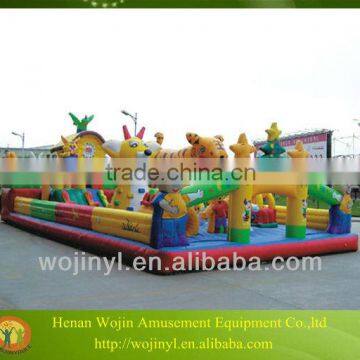 Happy fun outdoor kids playing inflatable weini bouncer castle