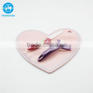 Heart shaped cutting board with knife