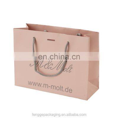 Luxury Custom Logo Gold Foil Printed White Cloth Paper Packaging Bag With Handle photo-5