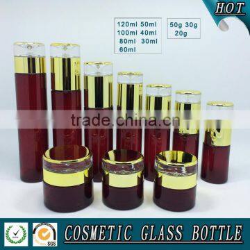 Cylinder RED coloured glass cosmetics bottles and face cream jars