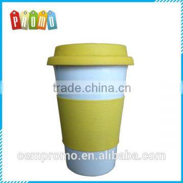 Promotional Ceramic travel mug with silicone lid and silicone removable part