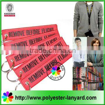 Remove before flight for airline lanyard/keychain