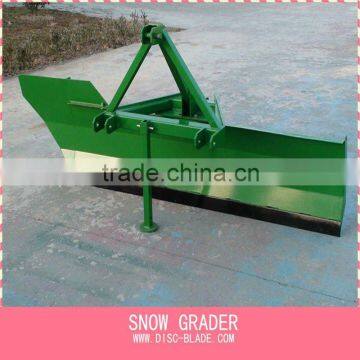 snow grader by tractor