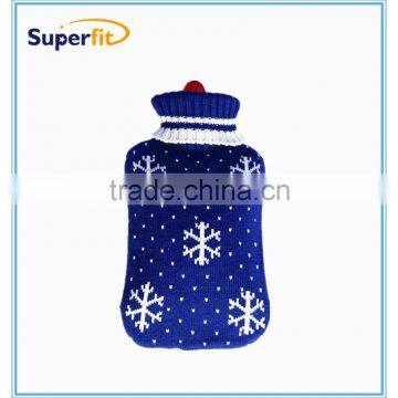 hot water bottle with blue snow knitted cover