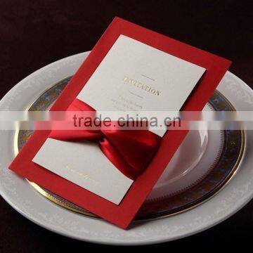 red elegant wedding invitations with hot foiling and ribbon