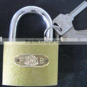 gold-colored spray paint iron padlock