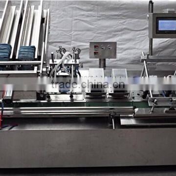 China Guangzhou GMP Standard Double Head Face Mask Making Machine photo-2
