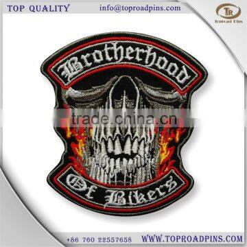 cheap custom fabric embroidery skull face patches with self-adhesive ( hot cut border )