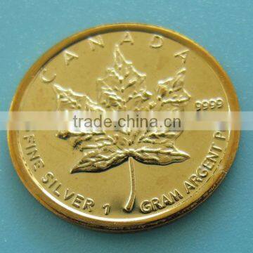 A87b2 1 gram silver coin with gold plated GP maple leaf with " .999 FINE SILVER " on the back Coin