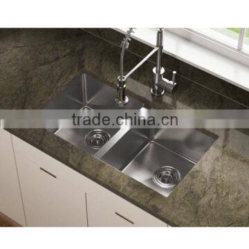 Undermount stainless steel handmade sink used in kitchen