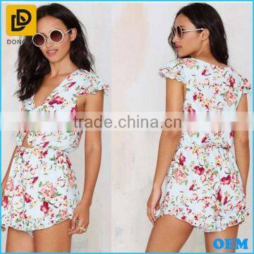 Light Blue Colorful Floral Print Romper Tie Closure At Neck Above Cutout & Ruffled Detailing At Hem And Sleeves