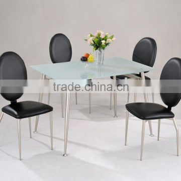 Tempered glass dining table and black pvc dining chair