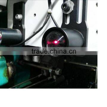 Laser blowing stop motion device for warp knitting machine