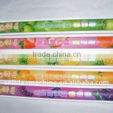 Ice lolly filling and packing machine