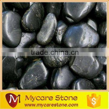 Irregular popular natural black pebble stone