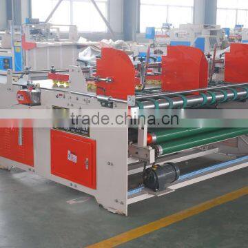 Corrugated paperboard folding gluing machine