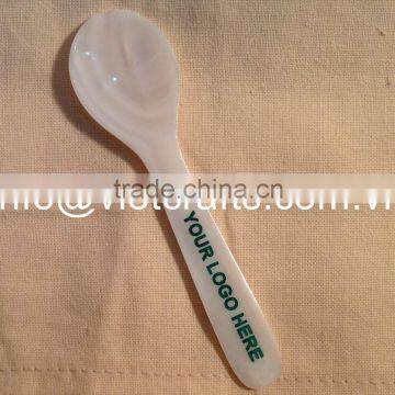 Caviar spoon with logo engrave, green logo color