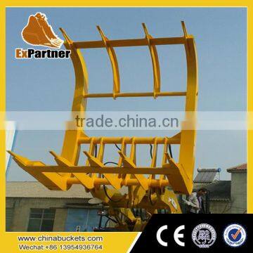 front end loader with dual single above clamp quick coupler log grapple