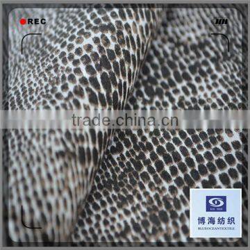 printed satin fabric with the pattern of snake skin