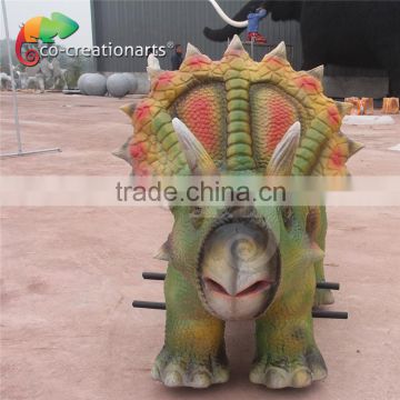 Funfair coin operated kiddie dinosaur rides