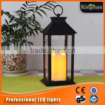 solar power lantern with candle inside