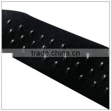 Coated elastic trims for bagging machine