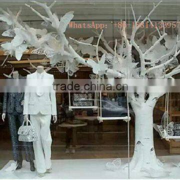 Shopping mall indoor decoration dry tree branches with leaves