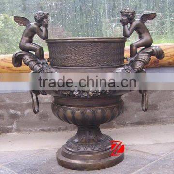 bronze flower pot with angel statues