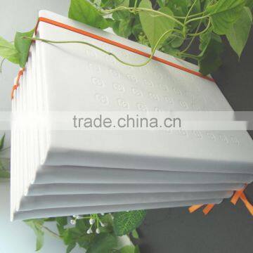 white pu full cover embossed logo notebook with orange elastic band