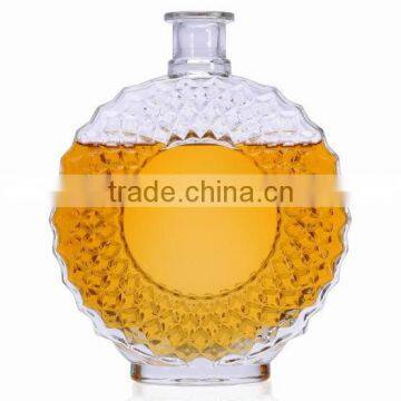 round empty glass liquor bottles