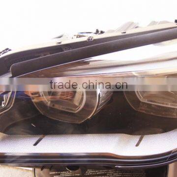 63117348496 HEAD LIGHT GENUINE