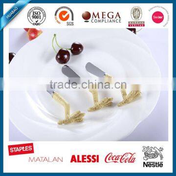 Top quality custom chicken feet shaped polyresin handle butter knife set, cheese spreaders
