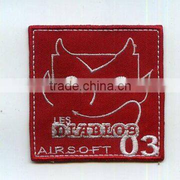 Number embroidery patch on red twill