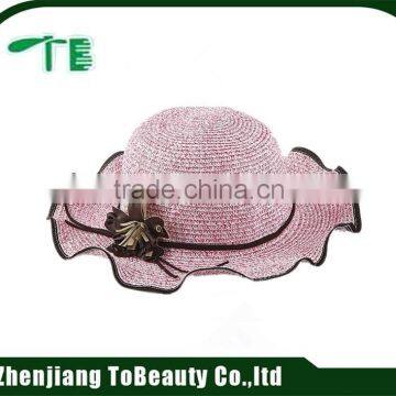 pink straw hat with flower decoration