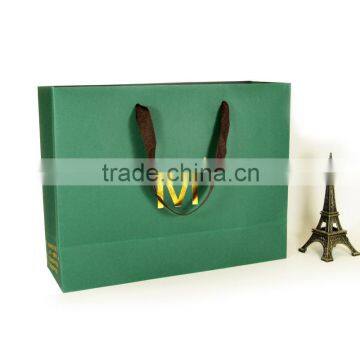 Designer green hot-stamping paper shopping handbags with flat roap