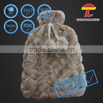 Rubber hot water bag with faux fur cover with pompom